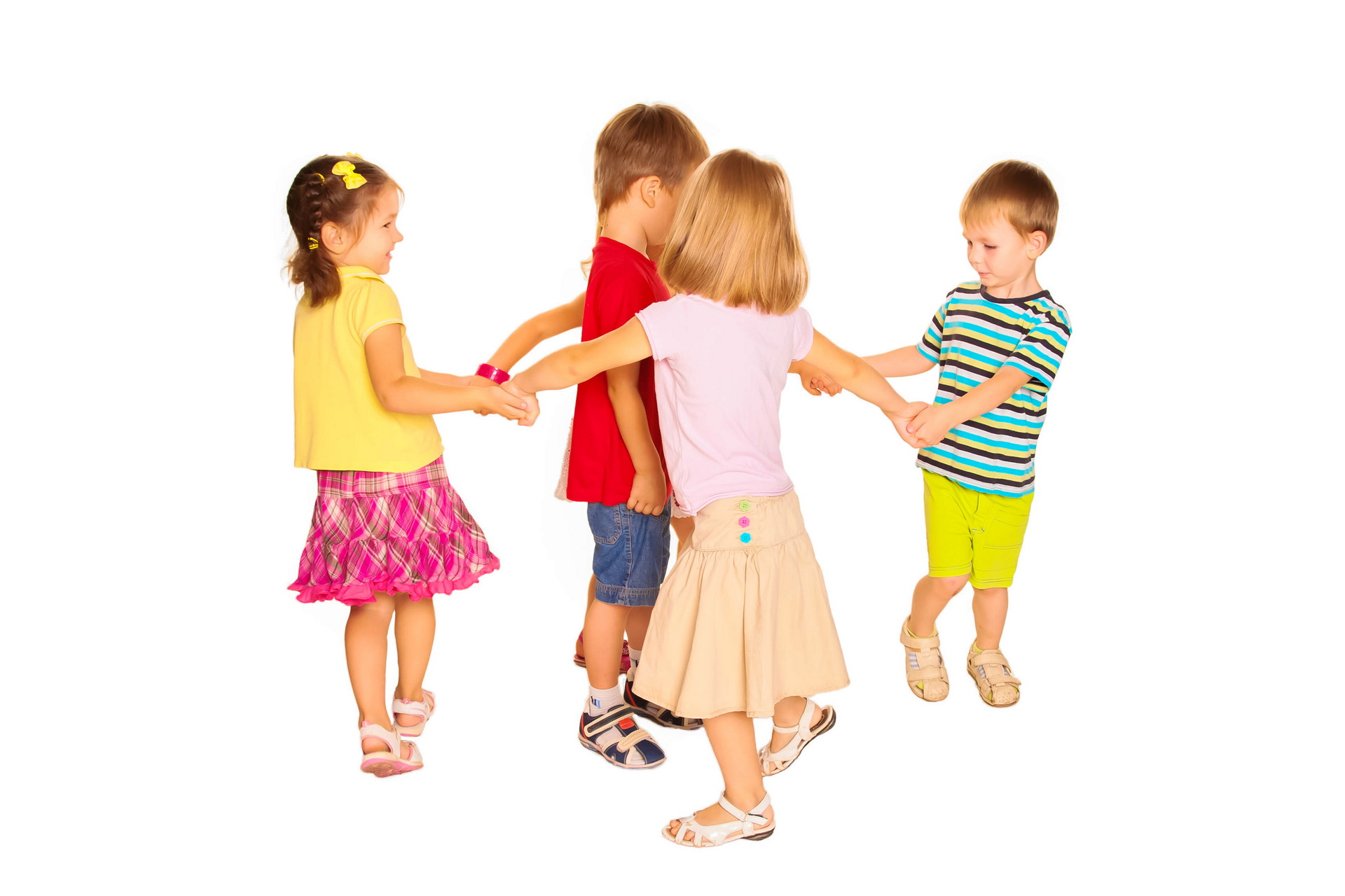 Group of little children dancing, having fun holding hands. Isolated on white background.
